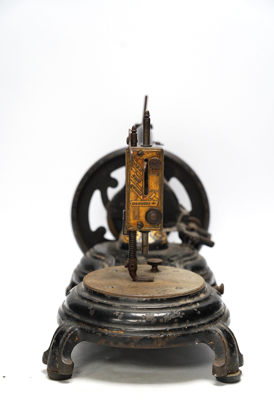 A late 19th century Jones swan neck sewing machine, with cast iron base and gilt ivy decoration to the frame. Condition - fair